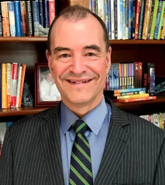 Dr. Richard Gajdowski, MD, Aesthetic Medical Director, smiling in a suit and tie.