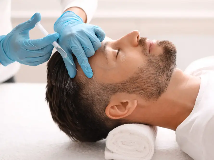 A client receiving a professional PRP therapy injection treatment for hair restoration at Xthetics Med Spa.