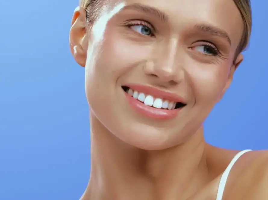Smiling woman showing smooth skin after a Density tightening treatment at Xthetics Med Spa.